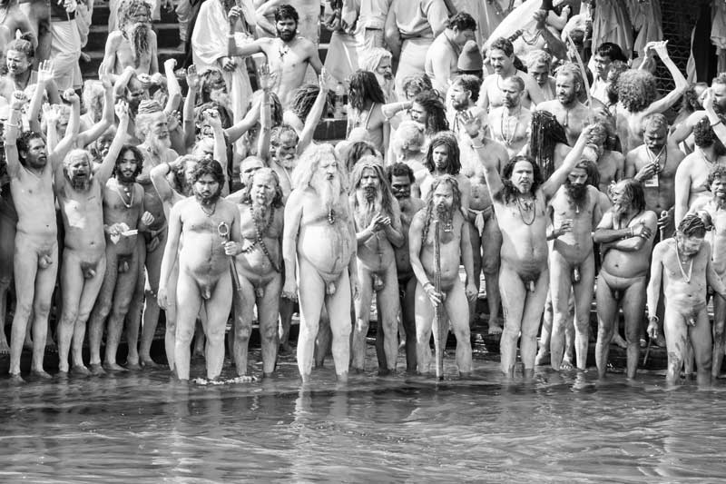 Naga Sadhus venerating the river and God Almighty before initiating the holy dip in river Ganga during Shahi Snan on the occasion of Kumbh at Har ki Pauri, Haridwar, Uttarakhand